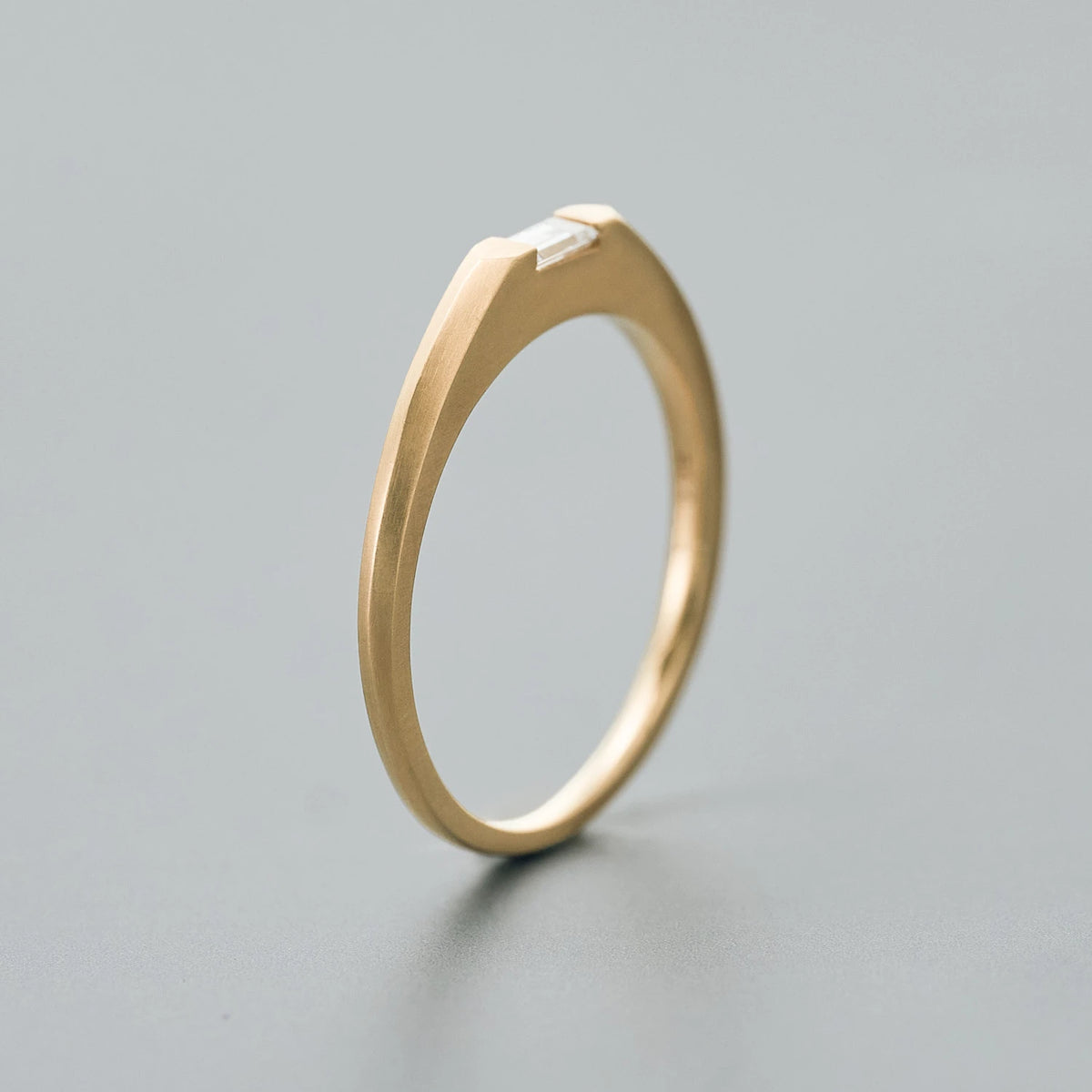 Arm with a slightly sloped tapered design from the top surface to the underside